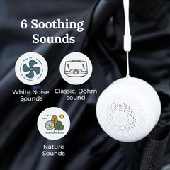 Yogasleep Travel Mini amber night-light provides a warm, non-disruptive glow.