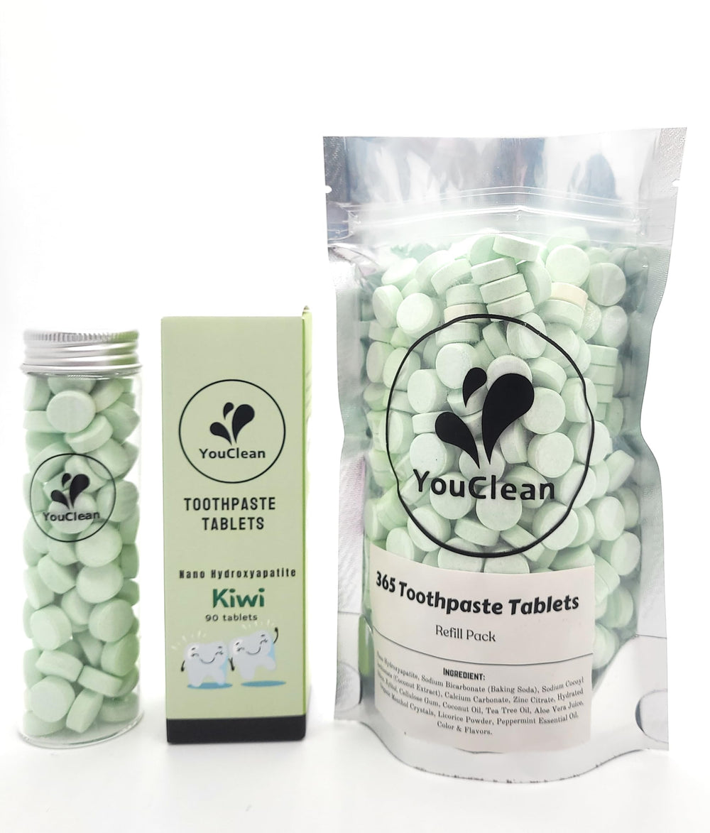 Close-up of YouClean toothpaste tablets inside the glass cylinder