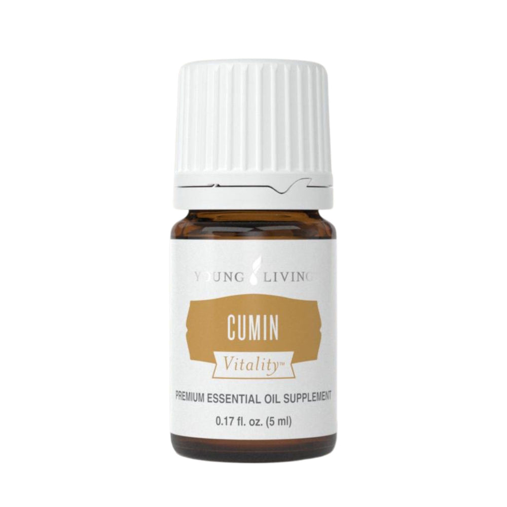 Young Living Cumin Vitality bottle in a kitchen scene for culinary flavor exploration.