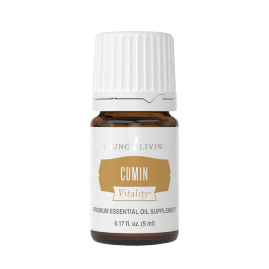 Young Living Cumin Vitality bottle in a kitchen scene for culinary flavor exploration.