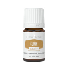 Young Living Cumin Vitality bottle in a kitchen scene for culinary flavor exploration.