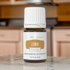 Young Living Cumin Vitality seasoning drizzle over finished dish.