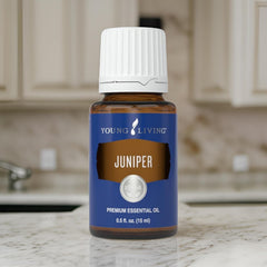 Young Living juniper essential oil dropper ready for precise use.