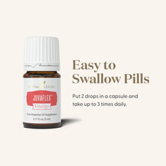 Young Living JuvaFlex Vitality bottle with glass and herbs signals gentle, effective wellness support.