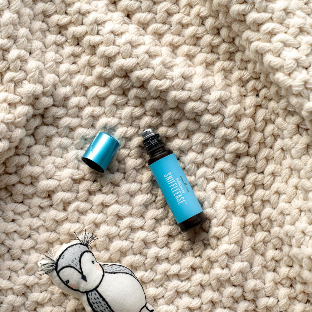 Young Living KidScents SniffleEase travel-pack demonstrates compact size for pockets.
