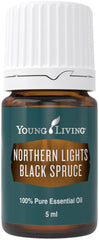 Young Living Northern Black Spruce essential oil bottle pour highlighting fresh evergreen aroma for grounding.