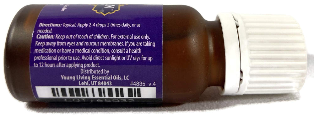 Young Living Shutran drop-form dispense shows easy, masculine fragrance application.