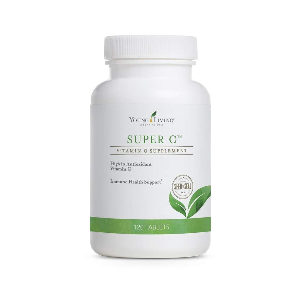 Young Living Super C tablets bottle on counter, boosting daily immune support with vitamin C.