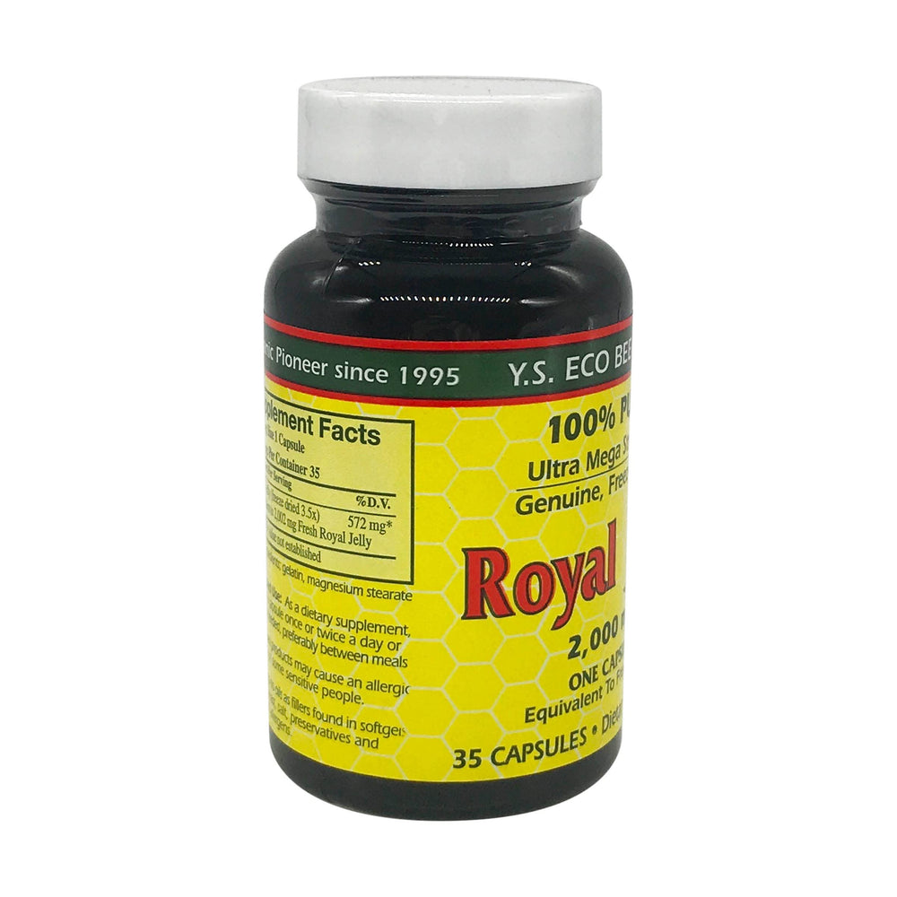 Royal jelly capsules on white background