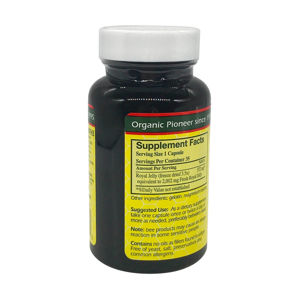 Capsules spilling from open bottle