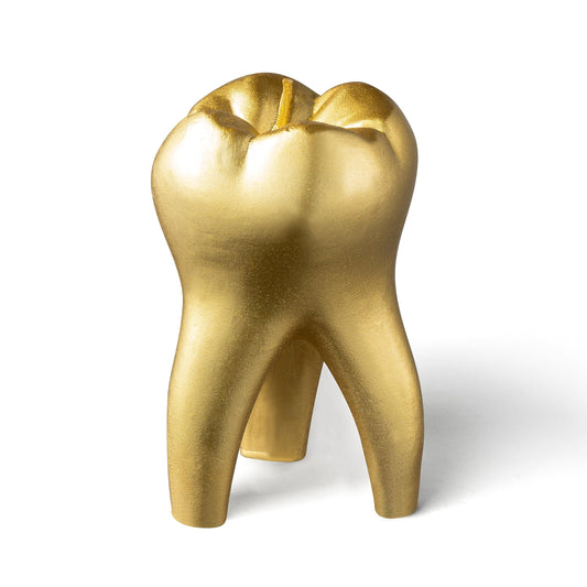 Gold tooth-shaped candle design