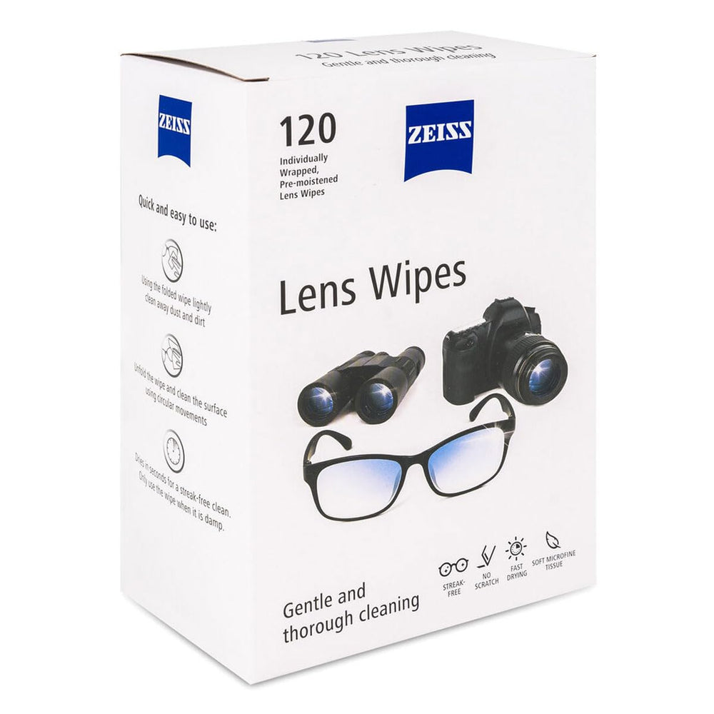 Individually wrapped pre-moistened lens wipe being removed from the box
