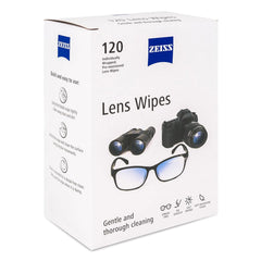 Individually wrapped pre-moistened lens wipe being removed from the box