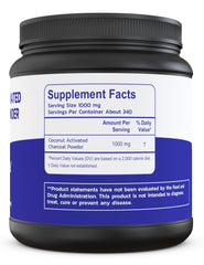 Activated charcoal powder in glass jar