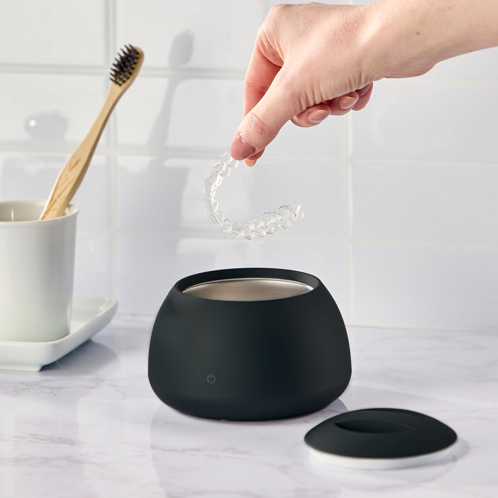 Zima Dental Pod cleaning a retainer