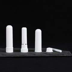 Close-up of refillable caps on white inhaler tubes