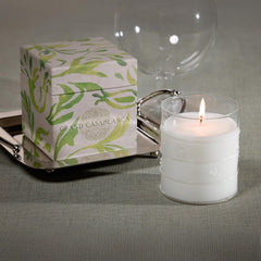 Zodax Grand Casablanca candle glowing warmly in a living space