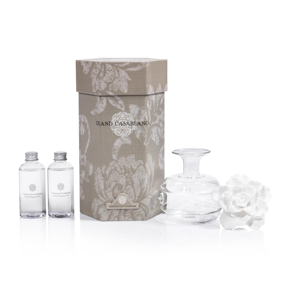 Porcelain flower diffuser inserted into the oil bottle