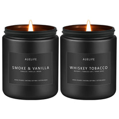 Two 7oz candles in matte black jars labeled Smoke Vanilla and Whiskey Tobacco