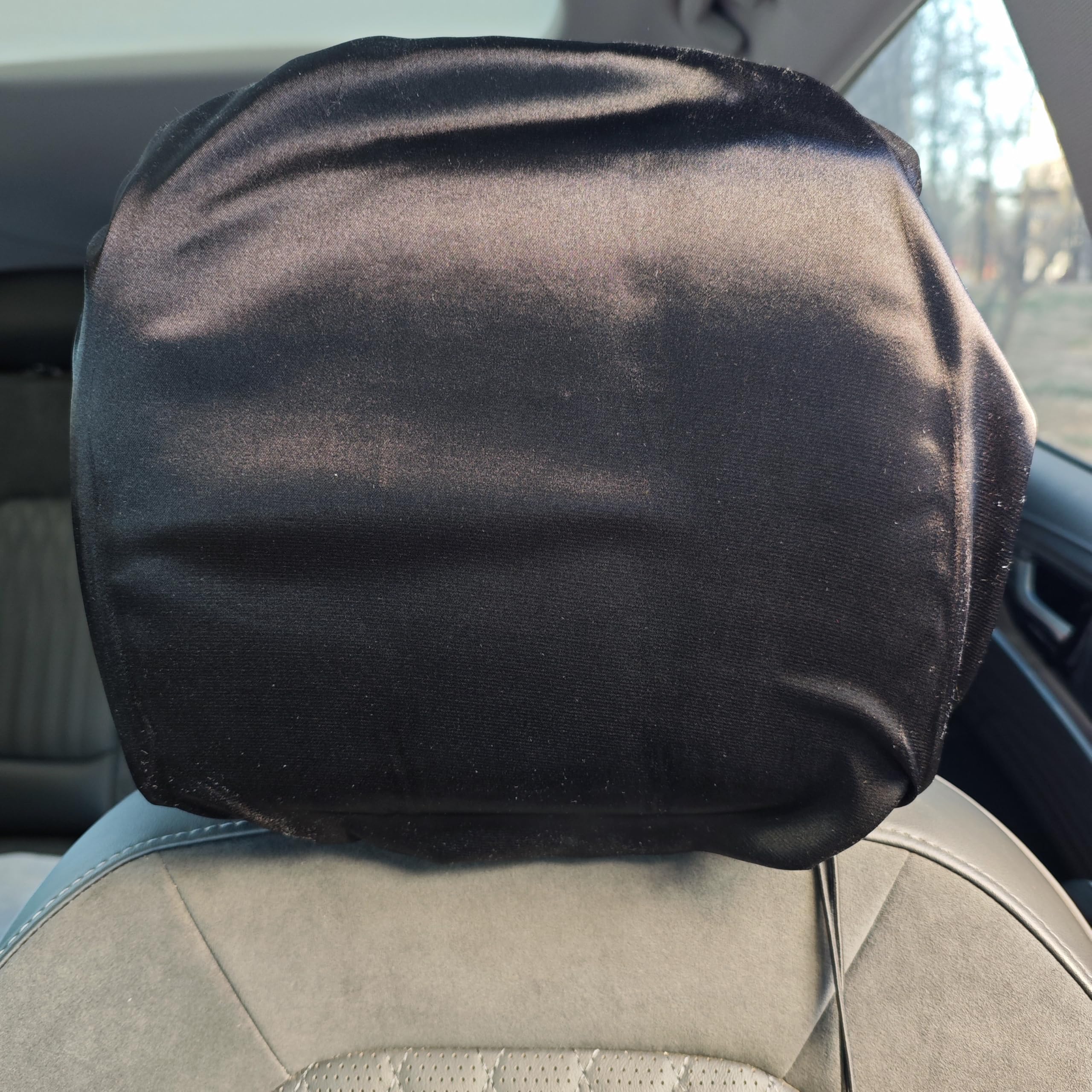 2-pack satin car headrest cover on headrest protecting hair during travel
