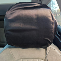 2-pack satin car headrest cover on headrest protecting hair during travel
