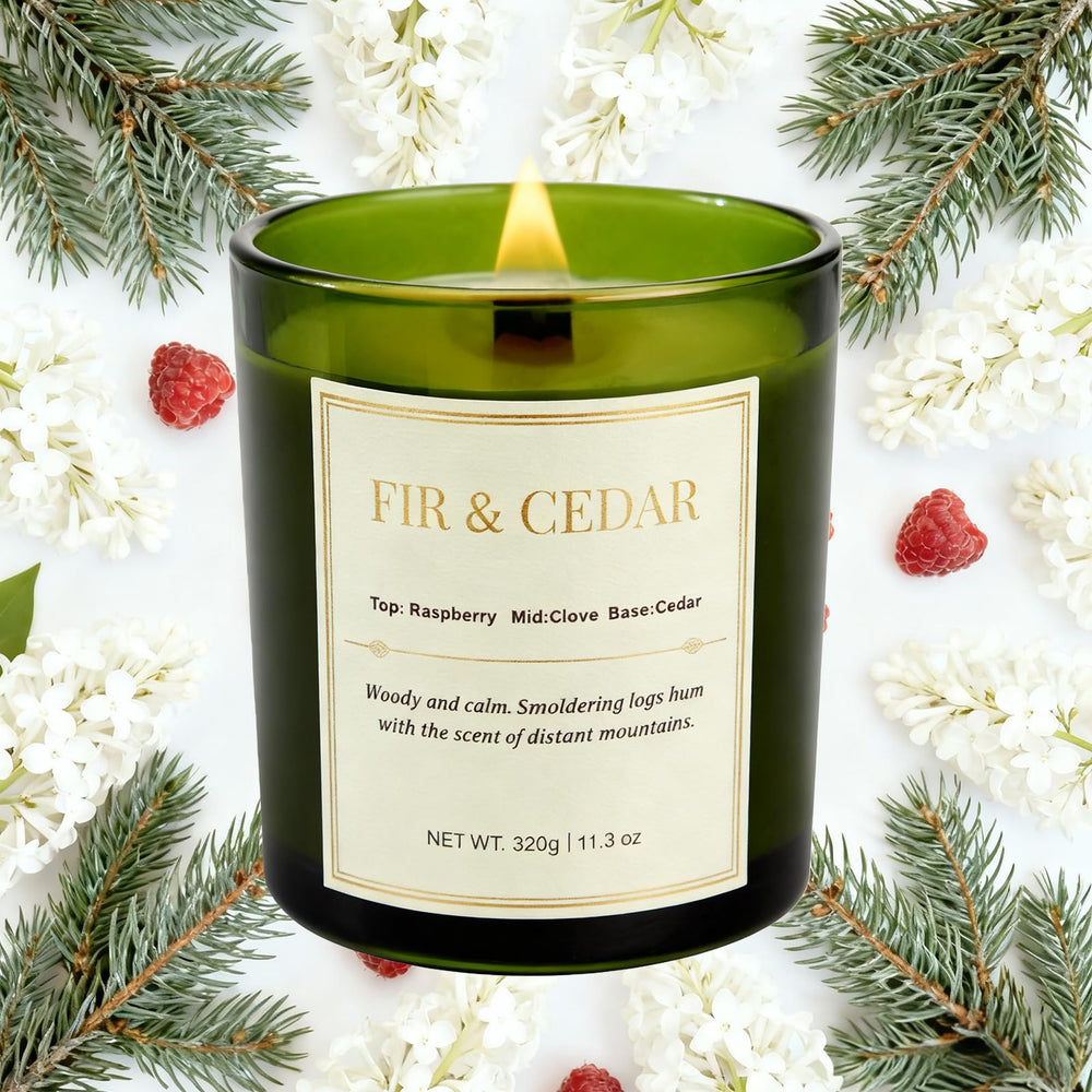 Close-up of Balsam Fir and Cedarwood candles in their gift boxes.