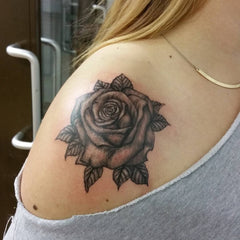 5X2Y Tattoo Tech feminine rose design with a realistic, long-lasting look.