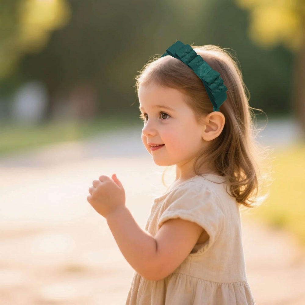 7Rainbows Spruce toddler headband knotted bow, gentle fit reduces discomfort.