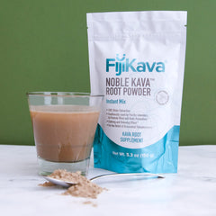 Instant kava powder effortlessly mixing with water in a glass