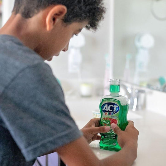 ACT Kids Fluoride Mouthwash Wild Watermelon Bottle Side View Pack of 3 with Accurate Dosing Cup