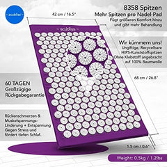 Purple Acubliss mat in use on bed for back pain relief