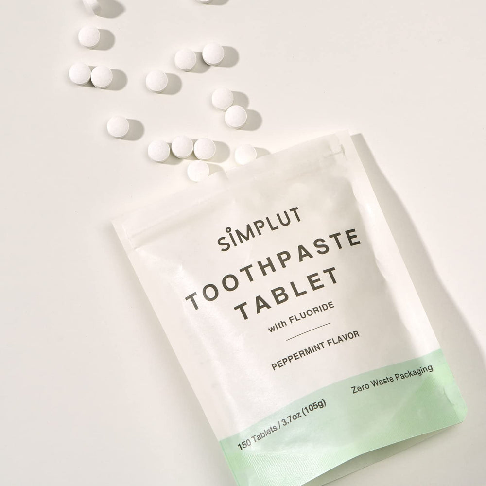 Adults using chewable toothpaste tablets for brushing