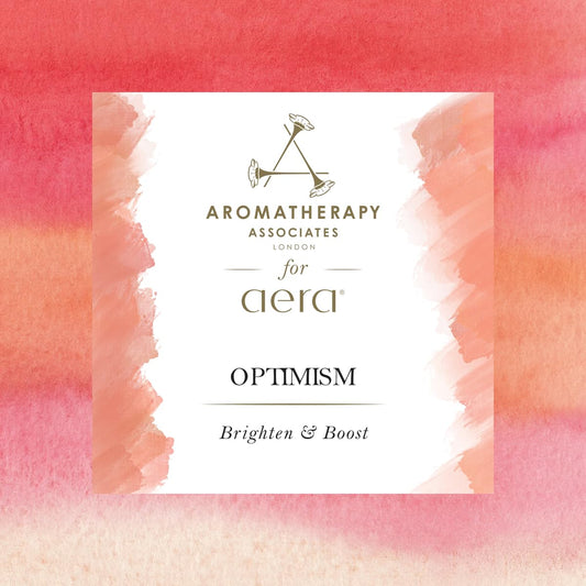 Close-up of Aera optimism aromatherapy refill showing bergamot, rose and basil notes