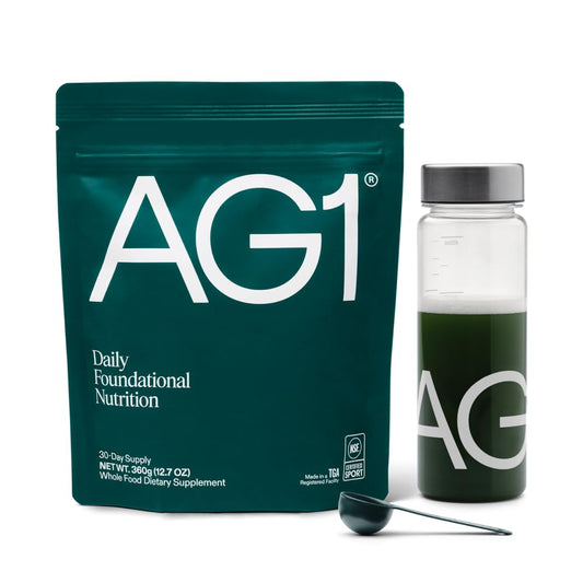 Bottle of AG1 Greens Powder Supplement with label visible
