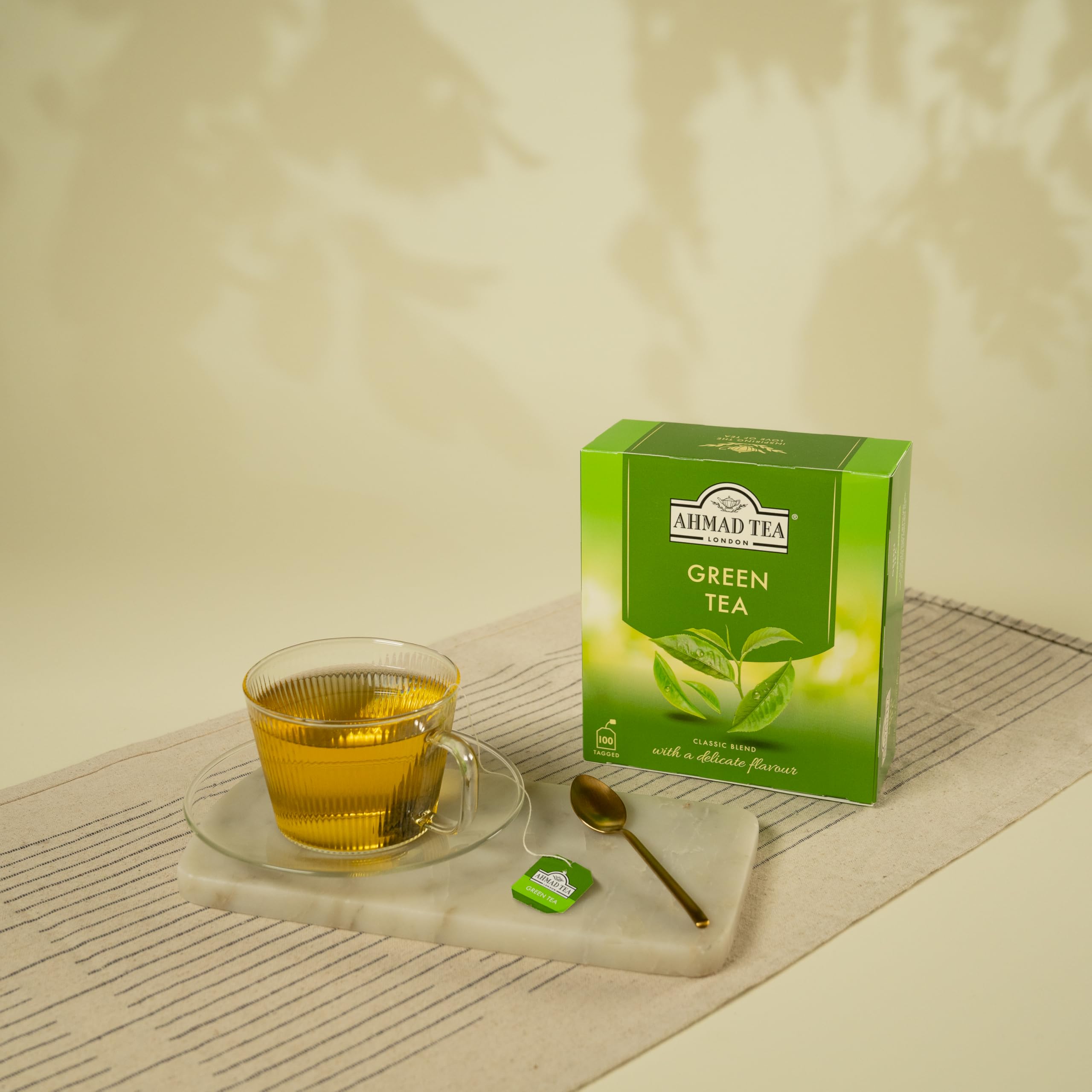 Green tea being brewed in a cup