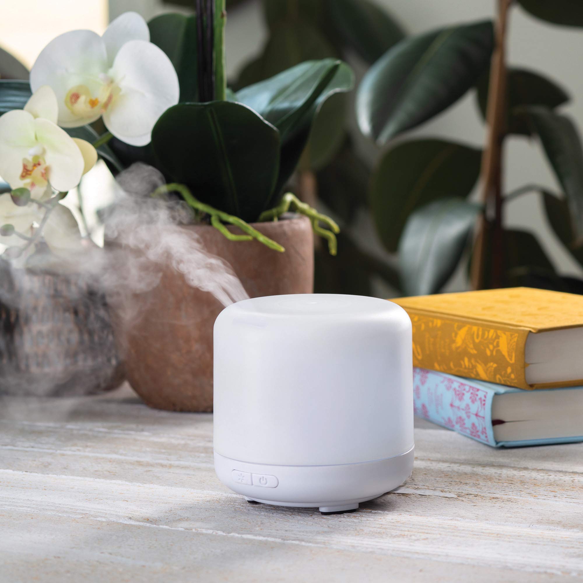 Airomé diffuser with directional slot directing mist to desired area.