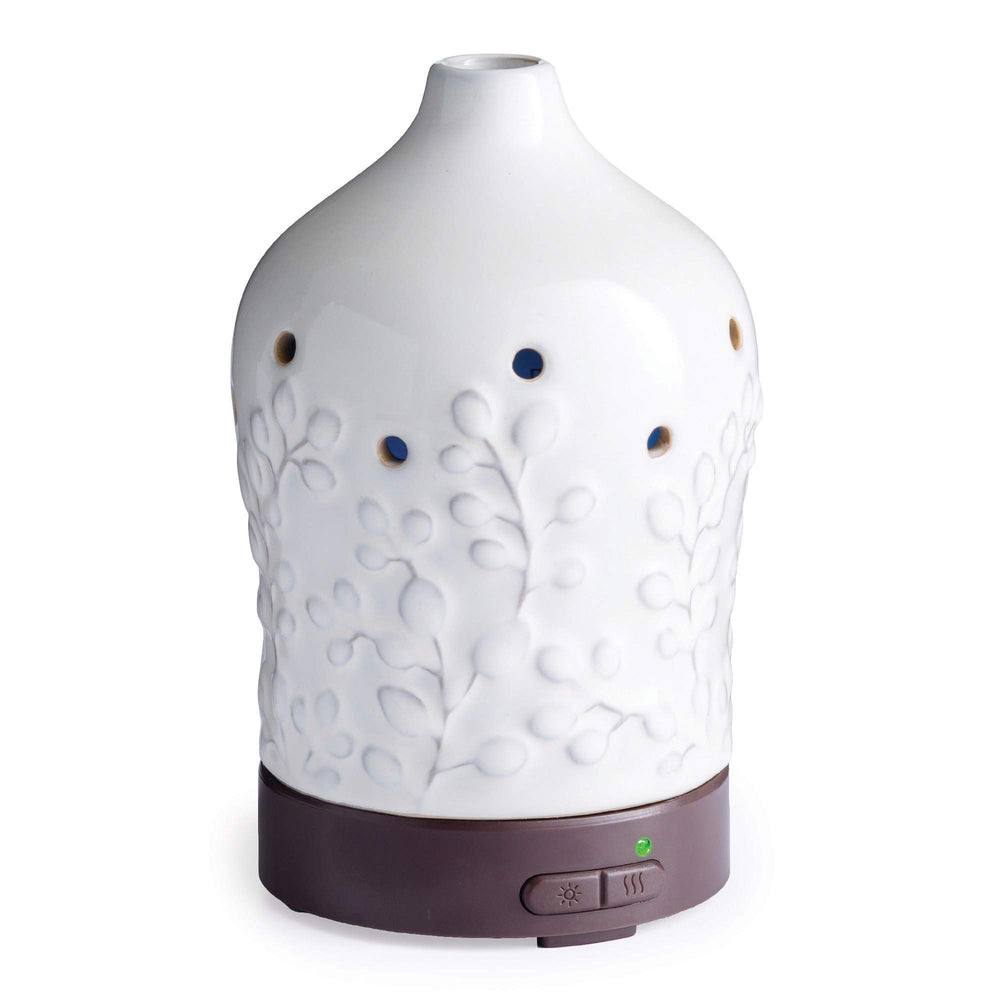 Airome Willow diffuser emitting a fine mist with colorful LED lighting