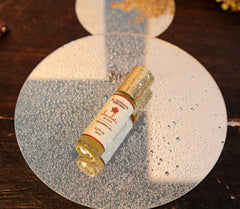 Side/back view of AL-HASNAYN Chocolate Musk Roll-On bottle