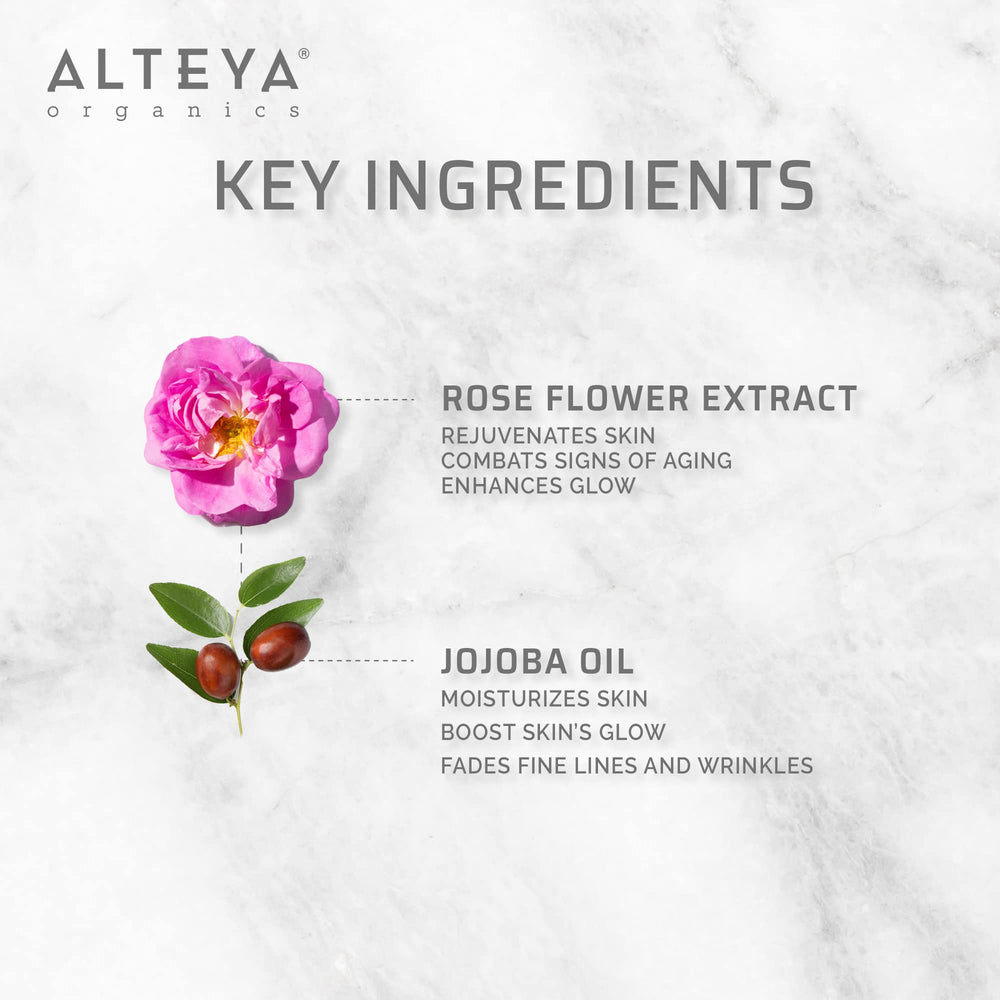 Rose absolute oil with rose petals background