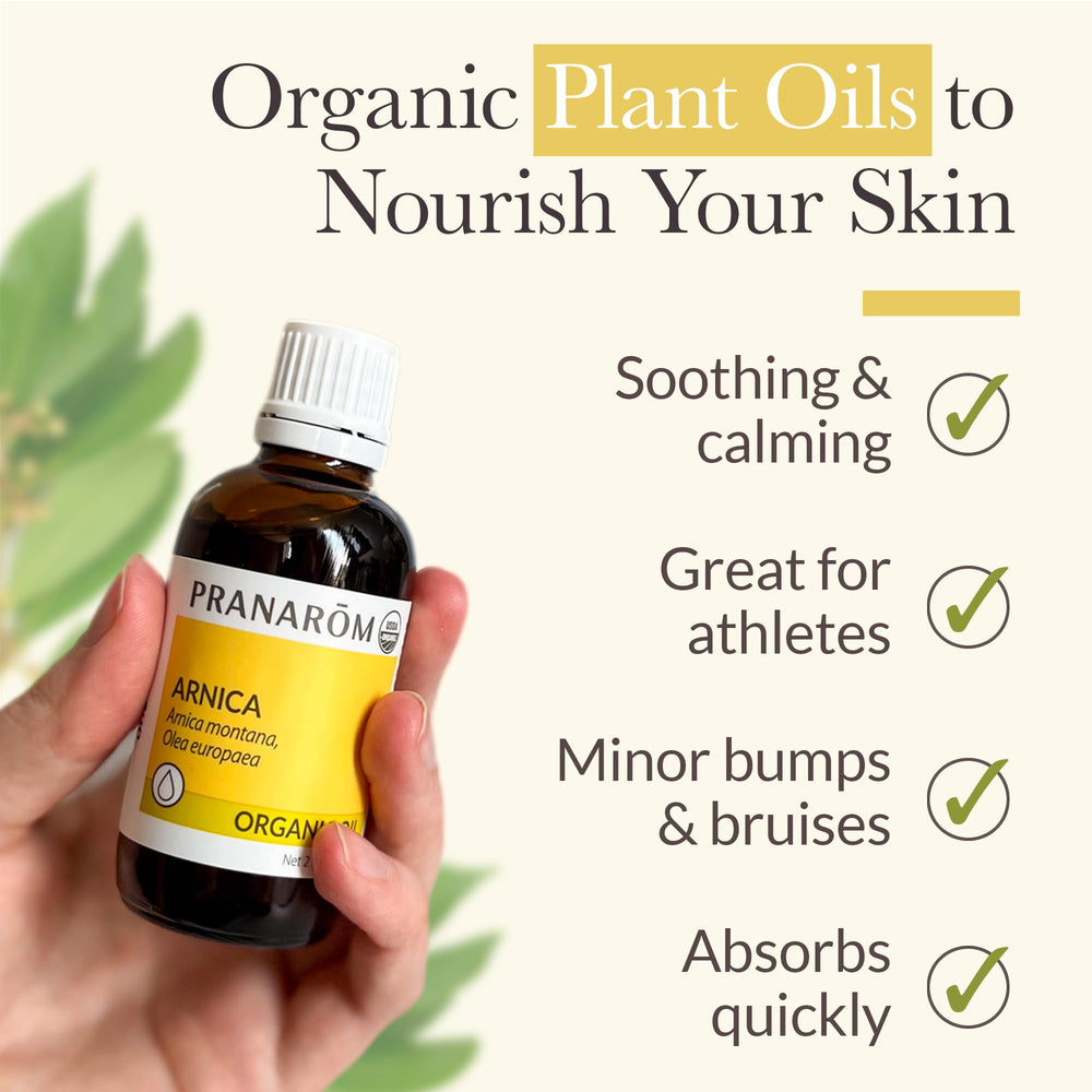 Amber glass bottle of Arnica oil for massage