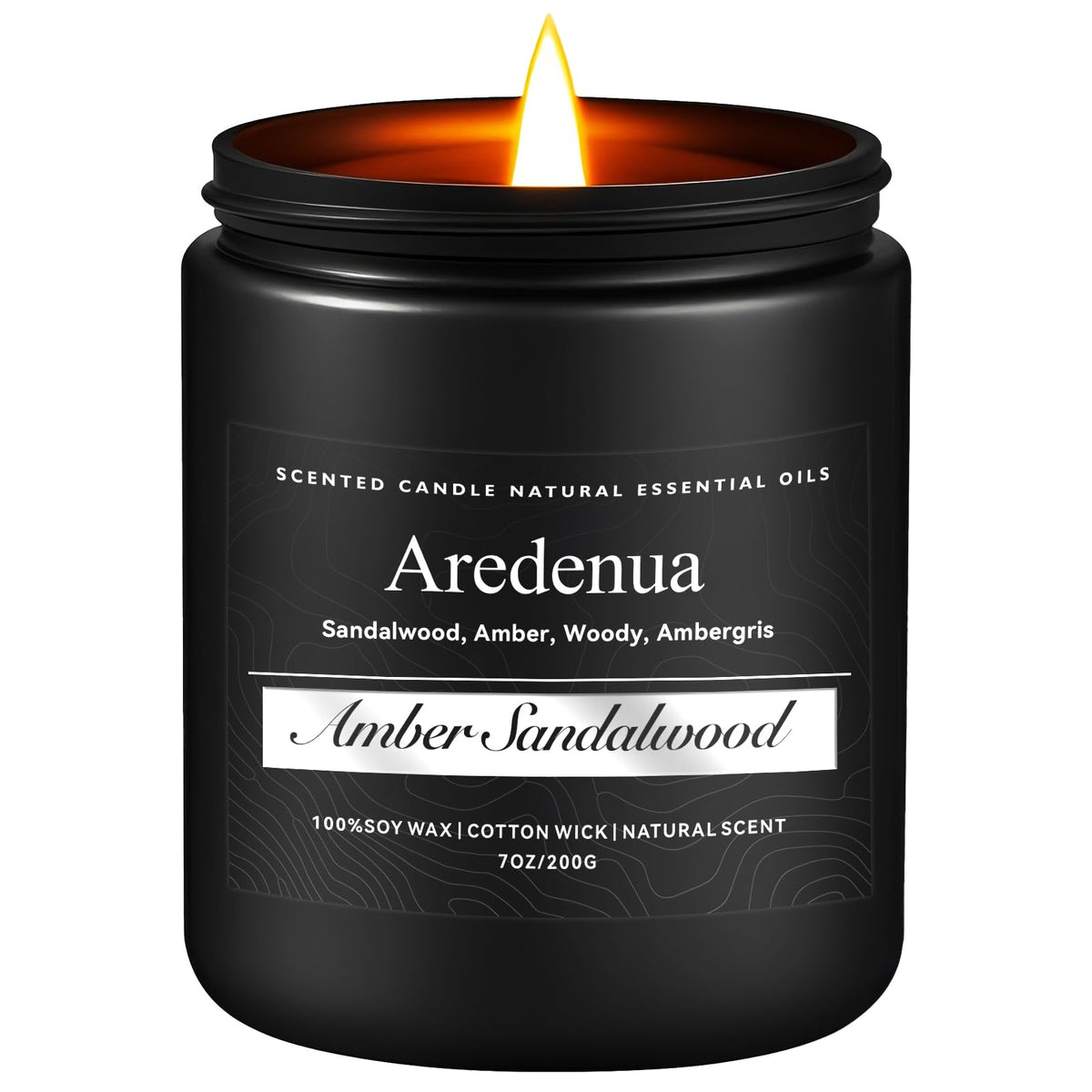 Amber Sandalwood scented candle in a clear glass jar burning with warm amber glow.