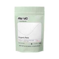 Bottle of Amy Myers MD Organic Reds Superfood Powder with a scoop