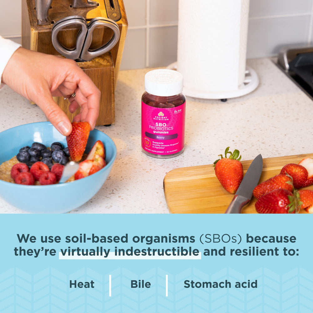 Adult and child consuming berry probiotic gummies
