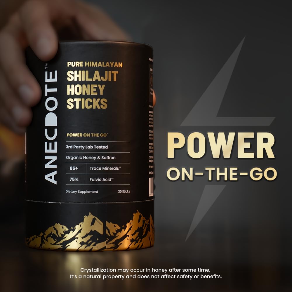 Organic honey, saffron threads, and Shilajit stick on a table
