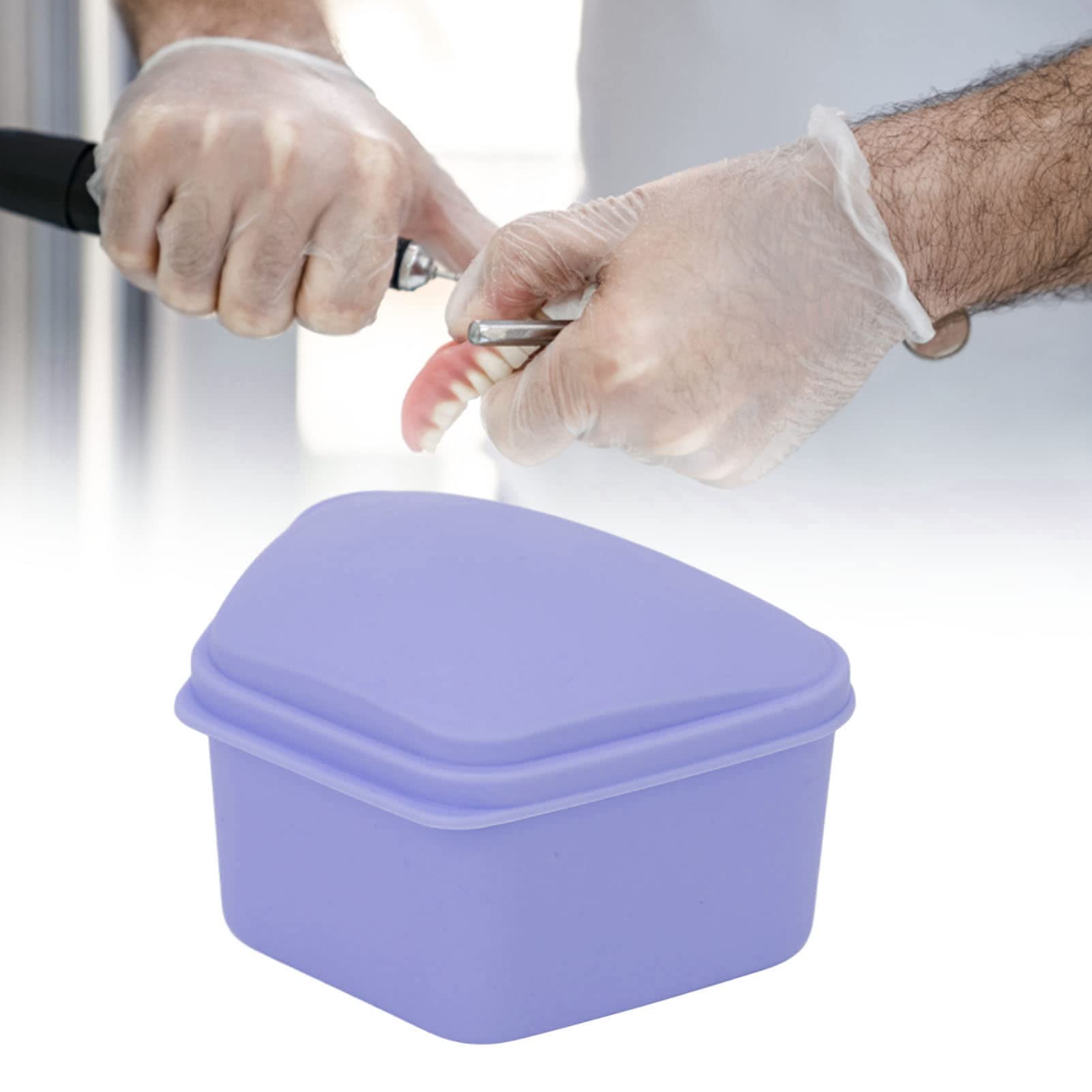 ANGGREK portable denture case carried in hand