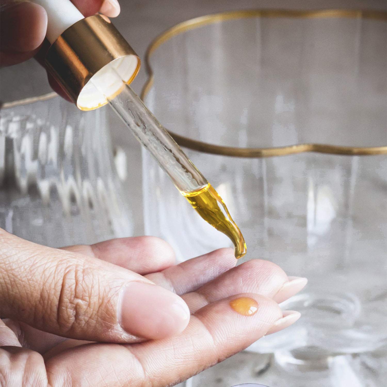 Hydrating facial oil poured into a glass dropper bottle