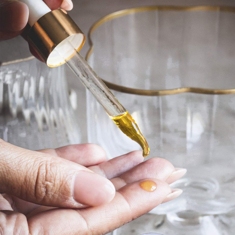 Hydrating facial oil poured into a glass dropper bottle