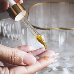 Hydrating facial oil poured into a glass dropper bottle