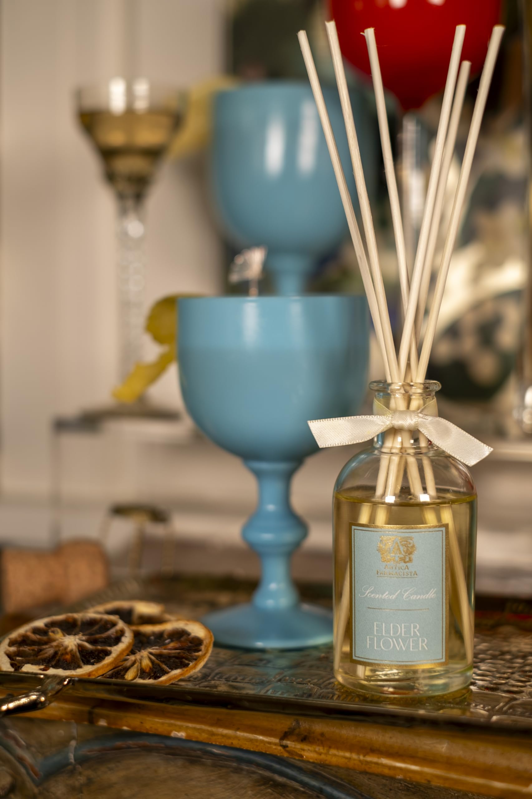 Close-up of elderflower aroma notes with diffuser bottle