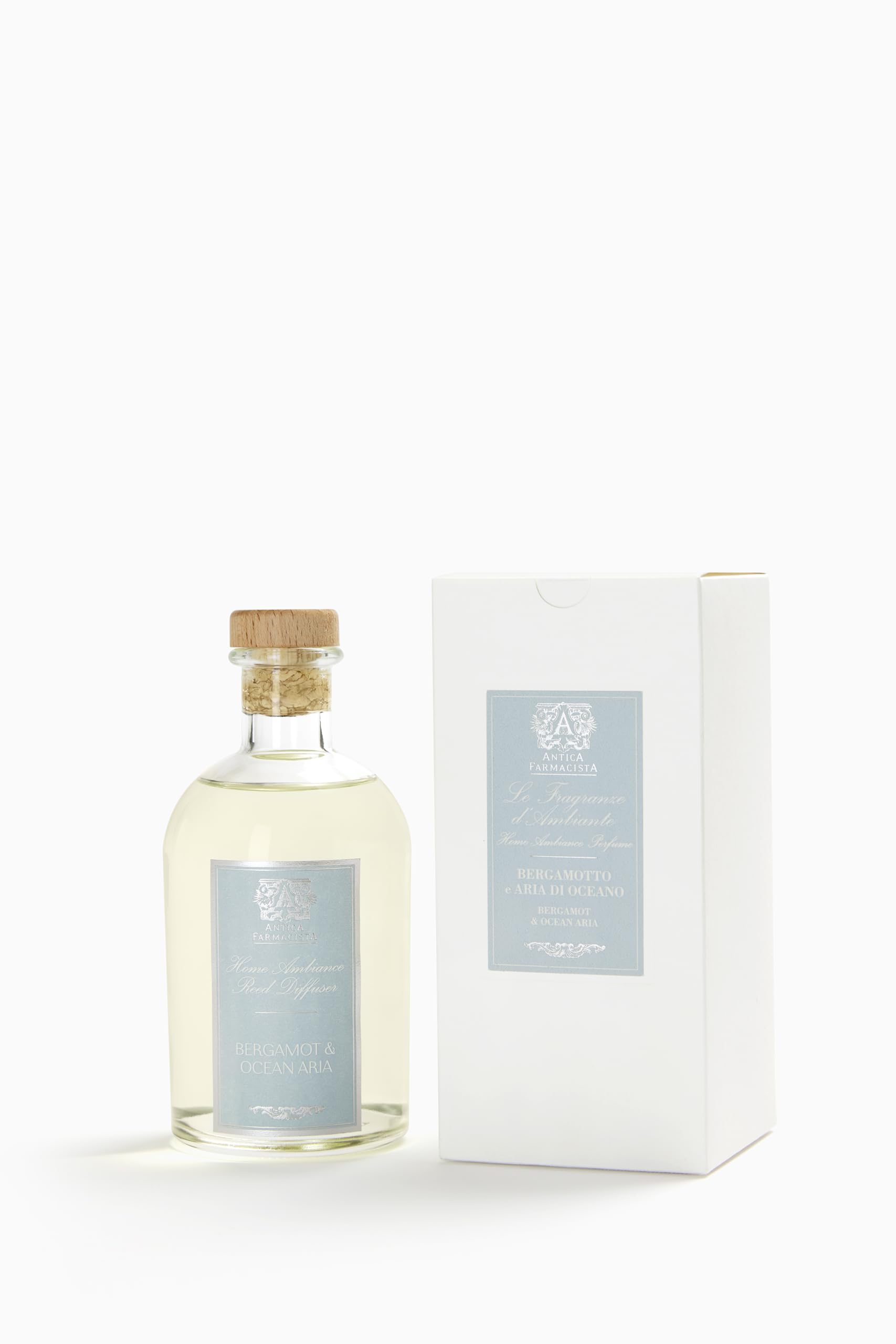Close-up of Antica Farmacista Home Ambiance Diffuser with reeds and glass bottle
